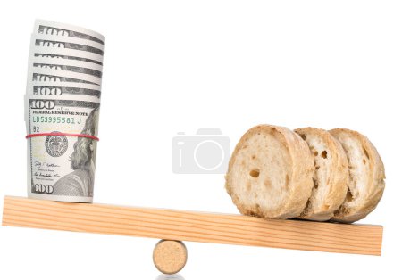 Photo for Inflation. Balance with bread and money. - Royalty Free Image