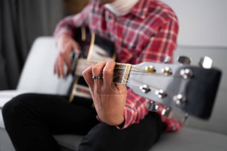 Photo for Close up male musician hands playing acoustic guitar. Copy space - Royalty Free Image