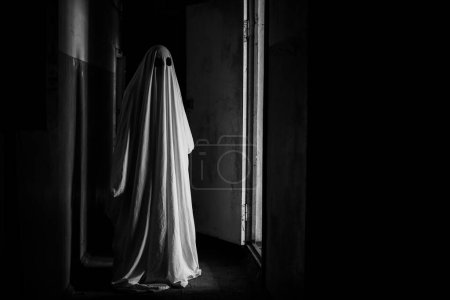 Photo for Black and white photo of Scary ghost in dark abandoned house. Copy space - Royalty Free Image