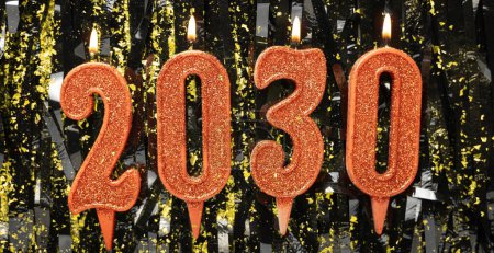 Bougies numéro 2030 de couleur rouge avec confettis sur un fond sombre. Composition du Nouvel An. Bannière. Espace de copie