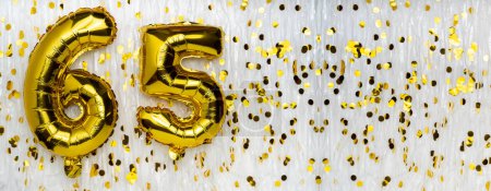 Golden foil balloon number, figure sixty-five on white with confetti background. 65th birthday card. Anniversary concept. birthday, new year celebration. banner, copy space.