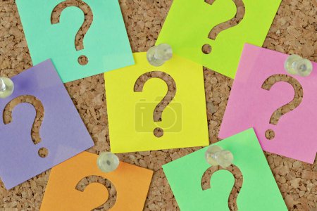 Photo for Post it notes with question mark on notice board - Concept of faq and finding information - Royalty Free Image