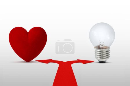 Photo for Two way arrows with heart and light bulb - Concept of choice between heart and mind - Royalty Free Image