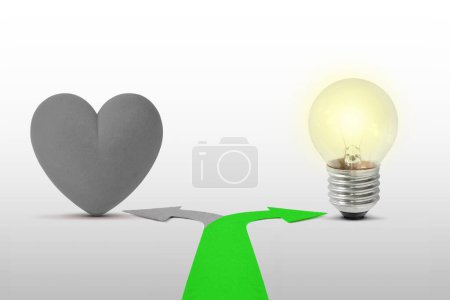 Photo for Two way arrows with heart and light bulb - Concept of choose mind over heart - Royalty Free Image