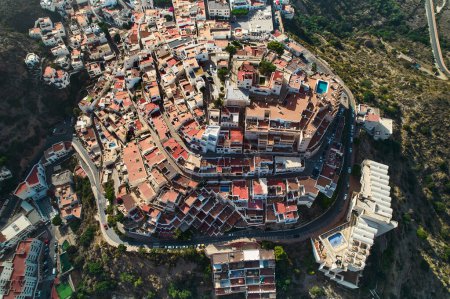 Photo for Aerial shot, drone point o view picturesque spanish hillside white-washed village of Mojacar surrounded by green mountains during sunny day. Travel destinations, famous places. Europe, southern Spain - Royalty Free Image