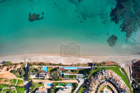 Photo for Drone point of view, aerial shot of spanish town of Dehesa de Campoamor during sunny day with Mediterranean Sea view. Costa Blanca, Alicante. Spain - Royalty Free Image