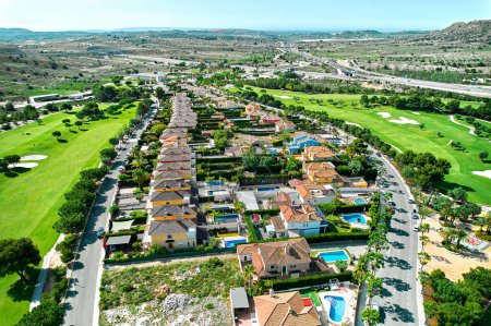 Photo for Aerial shot, drone point of view golf course during sunny summer day. Spain, Costa Blanca - Royalty Free Image
