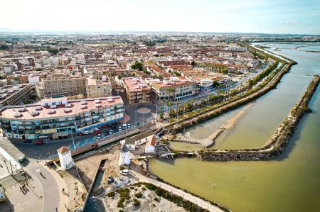 Photo for San Pedro del Pinatar townscape view from above, drone point of view during sunny summer day. This small seaside town is famous for its therapeutic mud baths and salt flats. Spain - Royalty Free Image
