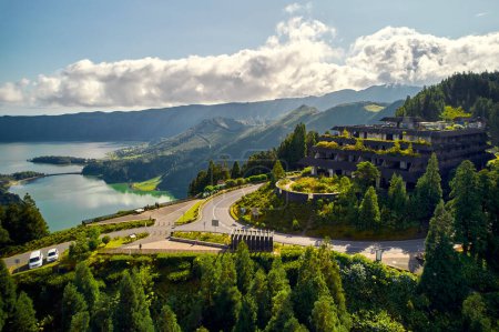 Photo for Aerial shot picturesque paradise of Sete Cidades in Azores, Sao Miguel. Volcanic craters and stunning lakes with abandoned Monte Palace hotel Ponta Delgada on hilltop, Portugal - Royalty Free Image