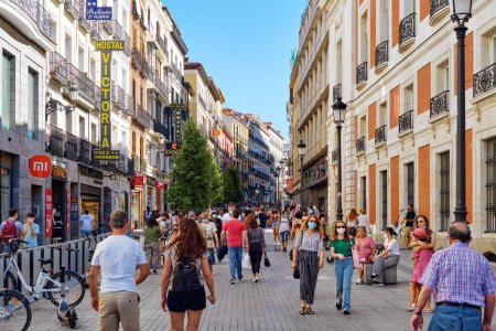 Photo for Madrid, Spain - June 29, 2021: Busy crowded street of Madrid city. Capital cities, lifestyle. Spain - Royalty Free Image