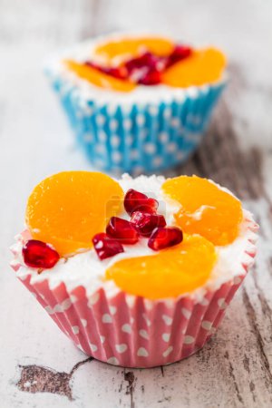 Photo for Delicious cupcake with fruit toppings. - Royalty Free Image
