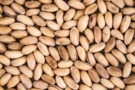 Photo for Large number of pistachio nuts creating a texture, background. - Royalty Free Image