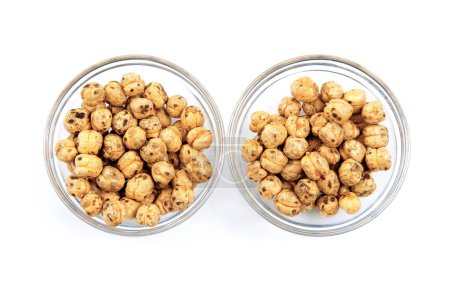 Photo for Roasted chickpeas in glass bowls on white surface. - Royalty Free Image