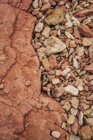Photo for Red and white rocks and stones on a rough and jagged surface. - Royalty Free Image