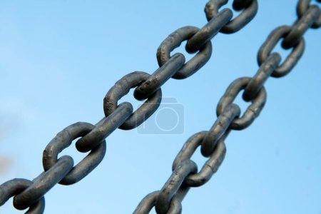 Photo for Close up of a powerful metallic chain, symbolizing strength and security in industrial applications. - Royalty Free Image