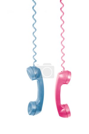 Photo for Vintage telephone handsets in pink and blue, a nostalgic communication concept. - Royalty Free Image