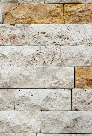 Photo for Rugged stone wall texture, blend of modern and old architectural styles, urban construction background. - Royalty Free Image