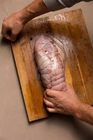 Photo for The process of stuffing turkey fillet for the Christmas table - Royalty Free Image