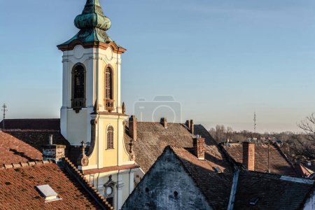 Photo for View of Blagovestenska church among old tile roofs. Szentendre, Hungary - Royalty Free Image