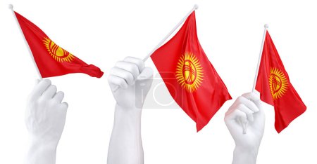 Three isolated hands waving Kyrgyzstan flags, symbolizing national pride and unity