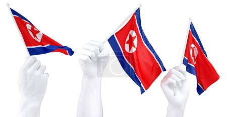 Tres manos aisladas ondeando banderas de Corea del Norte, simbolizando el orgullo nacional y la unidad
