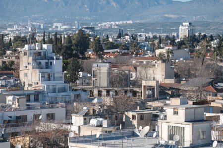 Aerial view of Nicosia urban landscape with mountains, buildings, and city skyline in Cyprus,