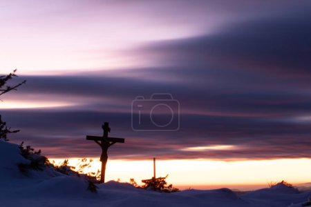 Photo for Christian wooden cross in dramatic lighting, colorful mountain sunset. Easter, resurrection concept. - Royalty Free Image