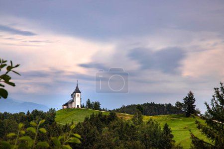 Jamnik, Slovenia. The Jamnik Church is a charming 15th-century chapel in the Kamnik-Savinja Alps near Kranj, breathtaking views of the surrounding mountainous landscape.