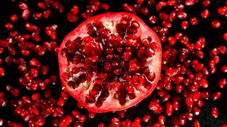 Photo for Fresh sliced pomegranate flying, freeze motion - Royalty Free Image
