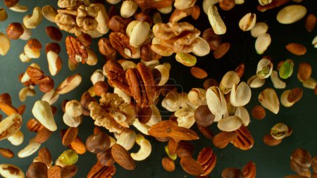 Photo for Freeze Motion Shot of Flying Various Nuts, Close-up - Royalty Free Image
