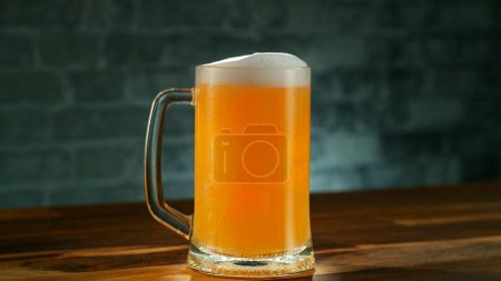 Téléchargez les photos : Pouring IPA beer into glass on old wooden table, close-up - en image libre de droit