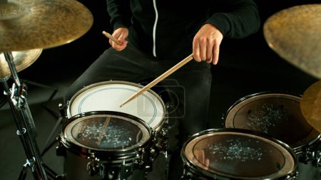 Photo for A drummer plays on a dark stage in the fog - Royalty Free Image