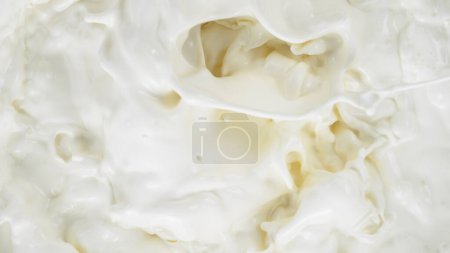 Photo for Freeze motion of whirling milk cream, close-up - Royalty Free Image