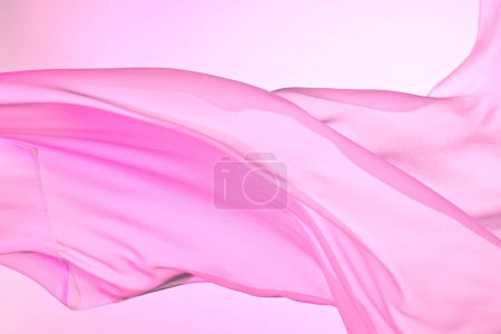 Photo for Closeup of rippled pink silk fabric, color fabric draped in soft waves empty bed sheet - Royalty Free Image