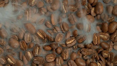 Photo for Roasting coffee beans with smoke permeating between the beans - Royalty Free Image