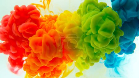 Abstract background, colorful liquid pouring isolated on white background, freeze motion