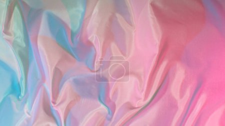 Téléchargez les photos : Tissu de soie transparent de couleur pastel coulant par le vent, - en image libre de droit