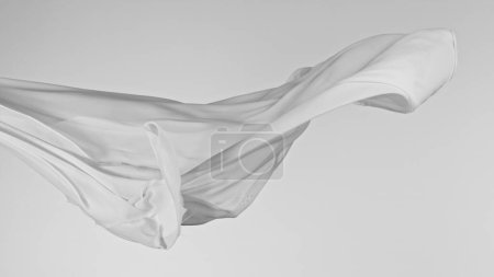 Téléchargez les photos : Tissu de soie transparent de couleur pastel coulant par le vent, gros plan - en image libre de droit