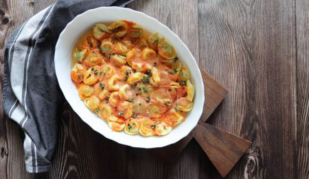 Photo for Tortelloni pasta witch riccota , spinach and creamy tomato sauce . - Royalty Free Image