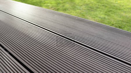 Outdoor plastic composite brown floor. Renovation terrace .