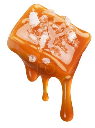 Photo for Salty caramel candy and drops of milk caramel sauce flowing down from it. File contains clipping path. - Royalty Free Image