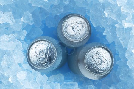 Foto de Cold bottles of beer in ice cubes, top view. Food and drink background. - Imagen libre de derechos