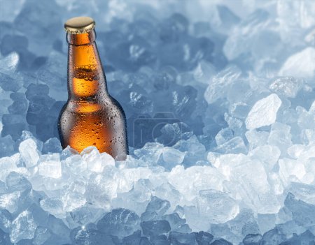 Foto de Cold bottle of beer in ice cubes. Food and drink background. - Imagen libre de derechos