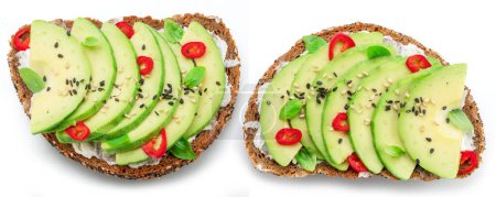 Photo for Avocado toasts - bread with avocado slices, pieces of chilli pepper and black sesame isolated on white background. Top  view. - Royalty Free Image
