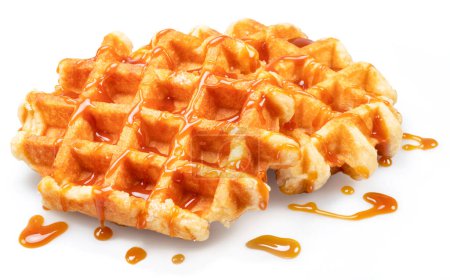 Foto de Belgian waffle with caramel topping isolated on white background. - Imagen libre de derechos