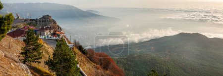 Photo for Beautiful autumn landscape in the top of Crimean mountains. Yalta town covered with clouds. Ukraine, Crimea, 2008-11-03 - Royalty Free Image
