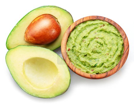Photo for Guacamole sauce and avocado fruit cross cut isolated on white background. - Royalty Free Image