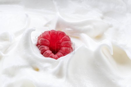 Photo for Fresh raspberry in the yoghurt or cream. Top view. - Royalty Free Image