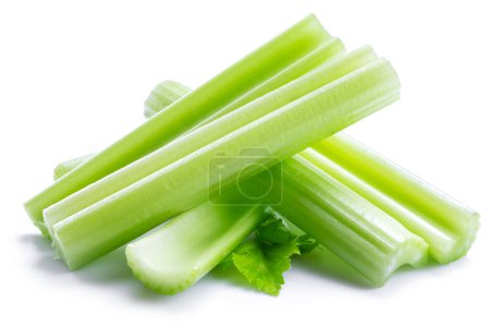 Photo for Pile of celery ribs and cuts isolated on white background. - Royalty Free Image