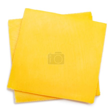 Photo for Square slices of meltable cheese, popular cheeseburger ingredient on white background. - Royalty Free Image